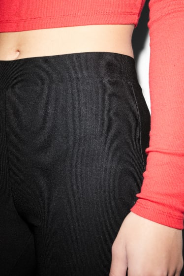 Clockhouse Girls - CLOCKHOUSE - jersey trousers - flared - black
