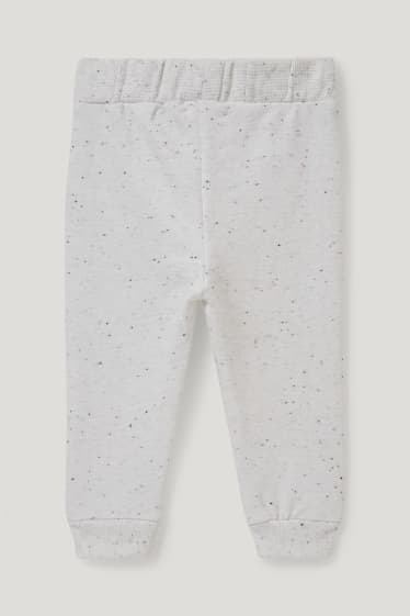 Miminka chlapci - Teplákové kalhoty pro miminka - krémově bílá