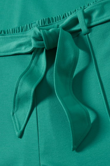 Kobiety - Spodnie dżersejowe - flared - zielony