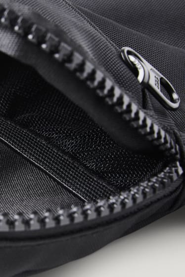 Small sports bag with shoulder strap - black