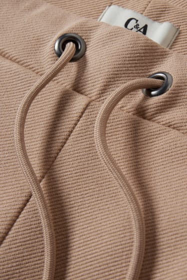 Women - Jersey trousers - tapered fit - beige