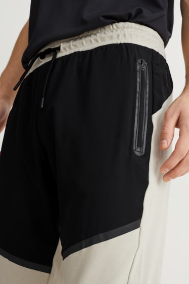 Hommes - Pantalon de jogging - noir / beige