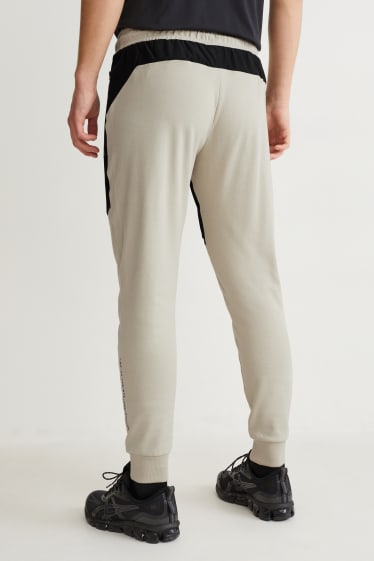 Hommes - Pantalon de jogging - noir / beige