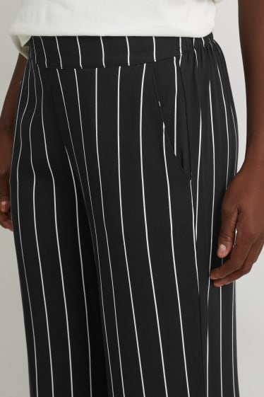 Women - Cloth trousers - high waist - wide leg - black