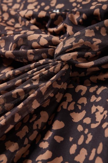 Dames - Rok met geknoopt detail in de stof - met patroon - zwart