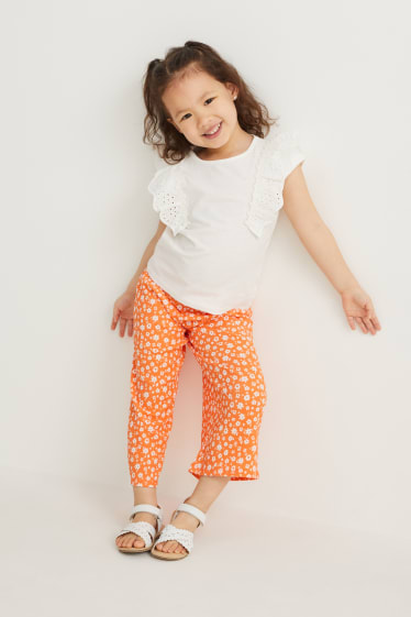 Nena petita - Pantalons de tela - de flors - taronja