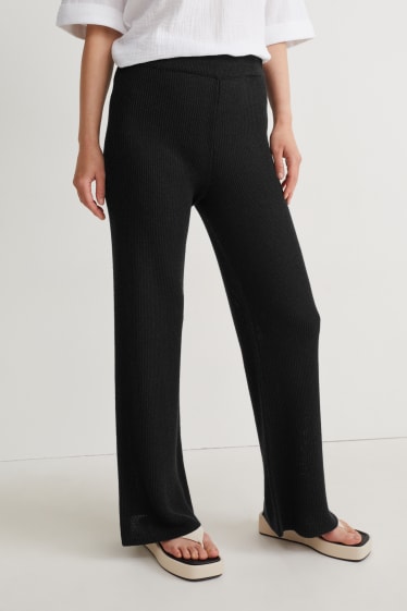 Women - Knitted trousers - mid-rise waist - palazzo - black