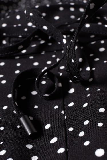 Women - Cloth trousers - high-rise waist - tapered fit - polka dot - black / white