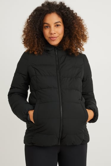 Women - Maternity quilted jacket with hood and baby pouch - black