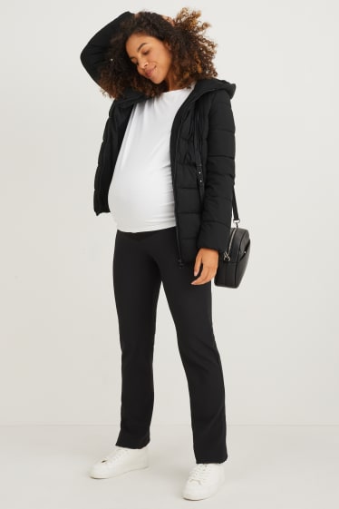 Women - Maternity quilted jacket with hood and baby pouch - black