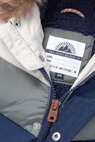 Baby Boys - Baby-Steppjacke mit Kapuze und Kunstfellbesatz - blau / dunkelgrün