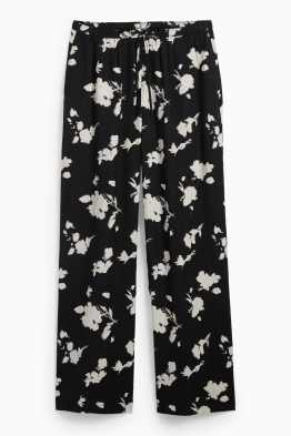 Pantaloni - vita alta - taglio ampio - a fiori - tessuto tramato