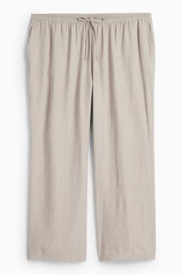 Pantaloni di stoffa - vita alta - gamba ampia - tessuto tramato