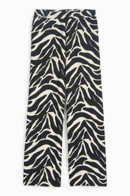 Žerzejové kalhoty - mid waist - wide leg - se vzorem