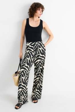 Žerzejové kalhoty - mid waist - wide leg - se vzorem