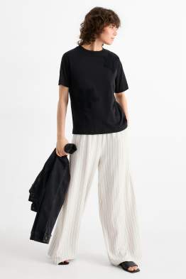 Pantaloni di stoffa - vita media - gamba ampia - design gessato