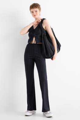 Pantaloni in jersey - vita media - flared - gessato