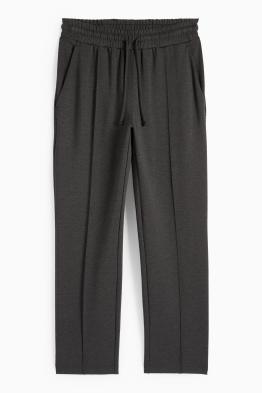 Žerzejové kalhoty - mid waist - tapered fit