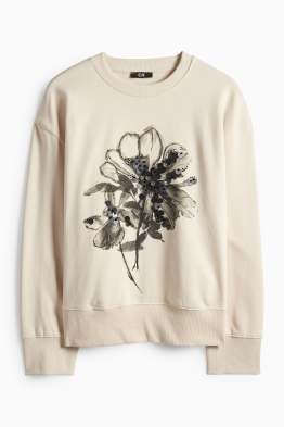 Sweat orné de pierres de strass