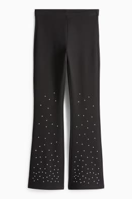 Leggings acampanados con pedrería