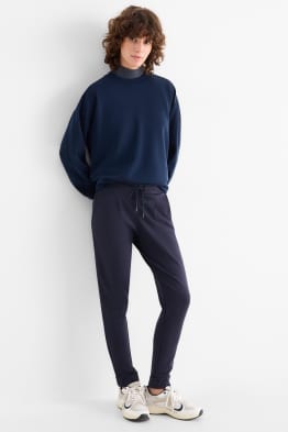 Žerzejové kalhoty - mid waist - tapered fit