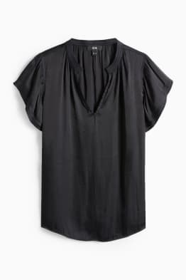 Brusa amb el coll en punta