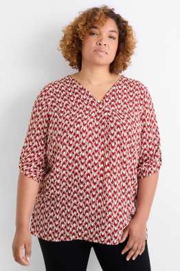 Brusa amb el coll en punta - amb motiu