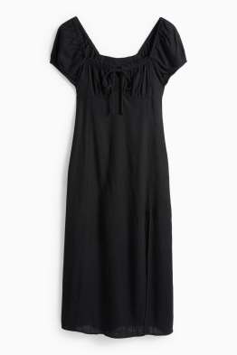 Vestit amb obertura i component de lli - de punt de niu d'abella