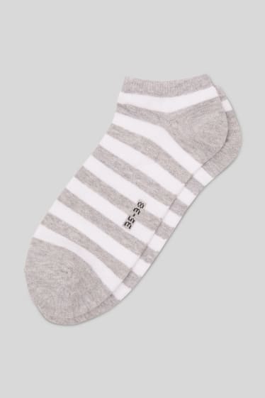 Femmes - Lot de 4 - chaussettes de sport - rayées - noir / blanc