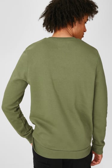 Mężczyźni - CLOCKHOUSE - bluza dresowa - zielony