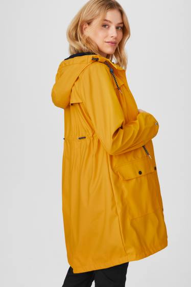 Women - Maternity rain jacket - with baby pouch - yellow