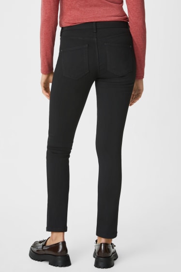 Women - Slim jeans - mid waist - black