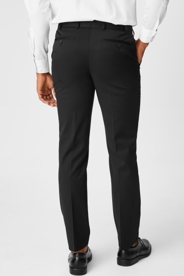 Hombre - Pantalón de traje - regular fit - elástico - negro