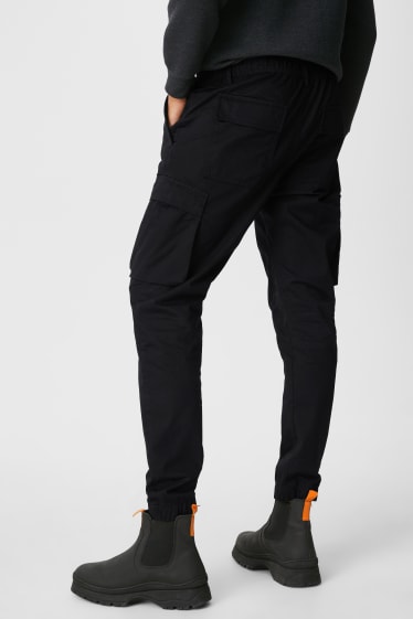 Mężczyźni - CLOCKHOUSE - spodnie bojówki - slim fit - czarny