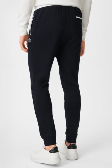 Hommes - Pantalon de jogging - bleu foncé