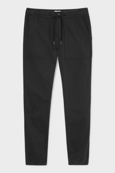 Bărbați - Pantaloni - tapered fit - negru