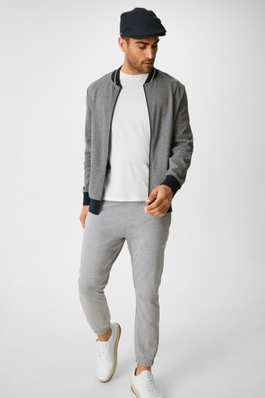 Uomo - Pantaloni sportivi - Flex - LYCRA® - grigio melange