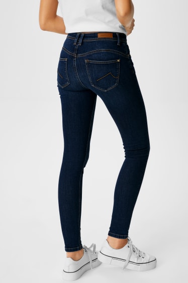 Kobiety - CLOCKHOUSE - skinny jeans - efekt push-up - dżins-niebieski