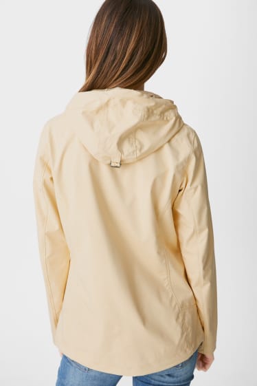 Women - Softshell jacket with hood - yellow