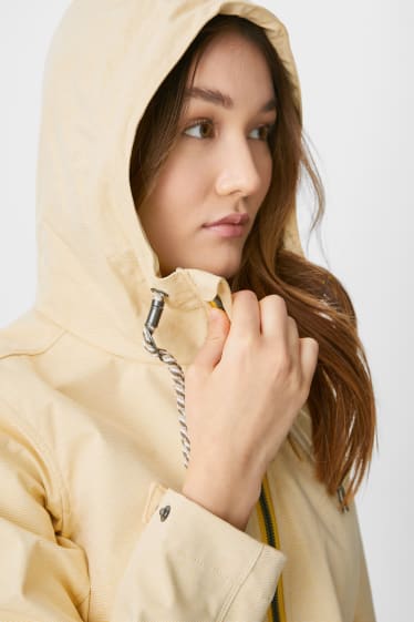Women - Softshell jacket with hood - yellow