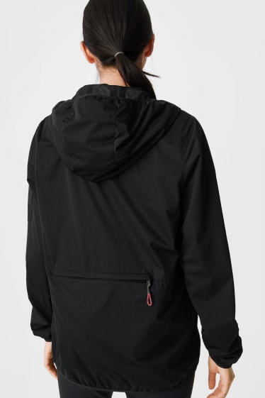 Women - Softshell jacket with hood - foldable - black