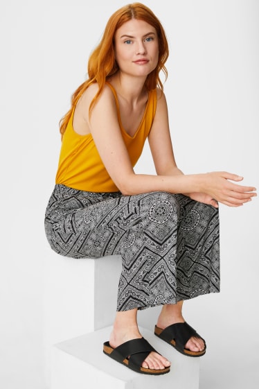 Women - Cloth trousers - palazzo - black / white