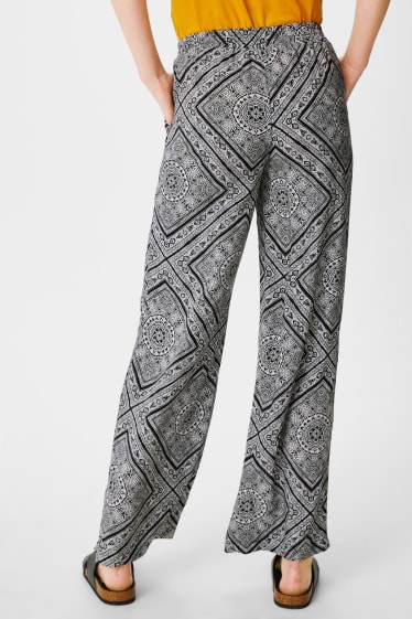 Women - Cloth trousers - palazzo - black / white