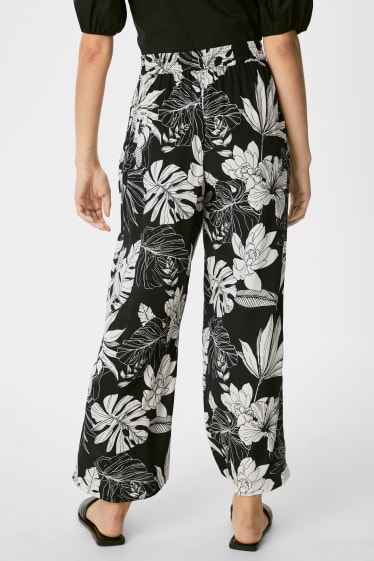 Donna - Pantaloni di stoffa - palazzo - a fiori - nero