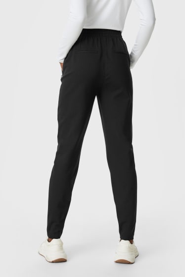 Femmes - Pantalon en finition jersey - jambes fuselées - noir