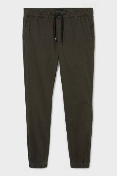 Hombre - Pantalón de deporte - tapered fit - LYCRA® - verde oscuro
