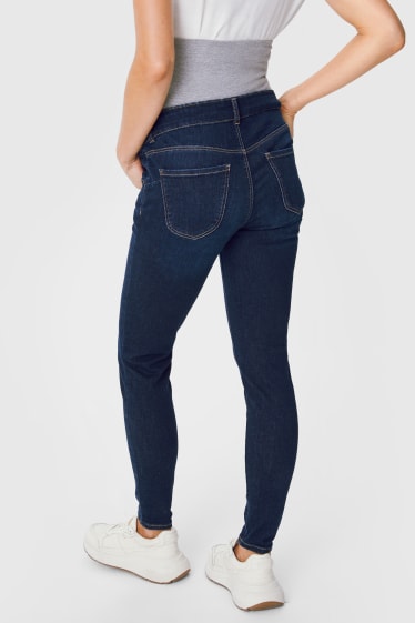Dámské - Tvarující těhotenské džíny - skinny fit - džíny - tmavomodré