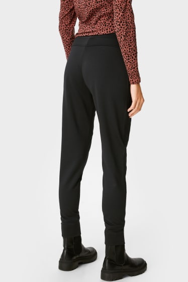 Women - Jersey trousers - tapered fit - black