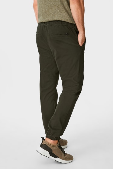 Pánské - Teplákové kalhoty - tapered fit - LYCRA® - tmavozelená