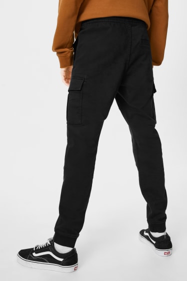 Mężczyźni - CLOCKHOUSE - spodnie bojówki - slim fit - LYCRA® - czarny